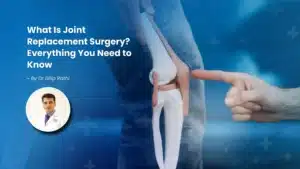 Orthopedic surgeon explaining knee joint replacement surgery using a knee model to a patient at RNH Hospital, Nagpur.
