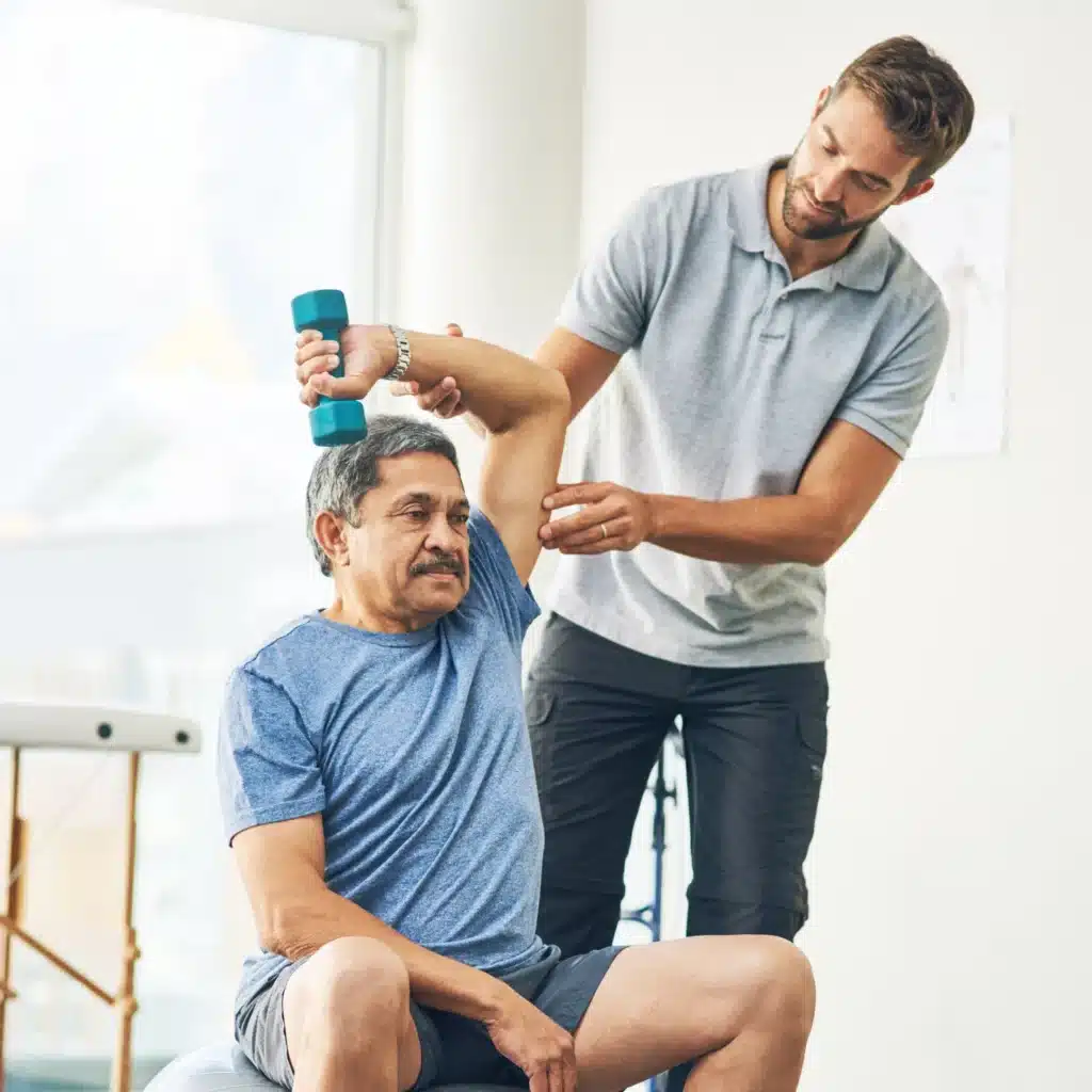 Physiotherapist guiding a patient through exercises for recovery and rehabilitation